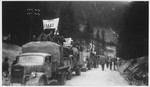 A convoy of Greek prisoners departs Ebensee for their repatriation.