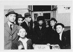 Group portrait of Orthodox men and a young boy standing next to a table in the Zeilsheim displaced persons' camp.