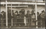 A witness signs the ketubah [marriage contract] at the marriage ceremony of a Yugoslavian-Jewish couple on board the SS Kefalos, sailing from Bakar to Israel.