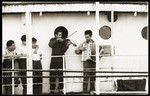 Two musicians perform on the deck of the SS Kefalos, sailing from Bakar to Israel.