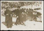 Refik Veseli (right) plays with Irena and Gavra Mandil in the snow during the period in which he hid them at his parents' home in Kruja.