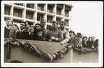Albanian soldiers and civilians watching a military parade marking the liberation of Tirana.