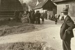 [Probably, Poles gathered outside their homes during a resettlement action.]  

One image of Einsatzgruppen activities in Poland in 1939, found by Joseph Igra after the war, in a an album in an apartment in Sosnowiec.
