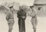 [Probably, two SD officers questioning a Polish cleric.] 

One image of Einsatzgruppen activities in Poland in 1939, found by Joseph Igra after the war, in a an album in an apartment in Sosnowiec.