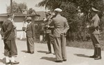 [Probably, SD officers questioning the ethnic German (Volksdeutsche) inhabitants of a Polish town.]  

It was standard practice during the Polish campaign for the SD and German military to question local ethnic Germans for information pertaining to Poles considered Deutschfeindlich, or "hostile to Germans."  Poles and Jews named during such interviews were then arrested as suspected opponents and either shot or sent to the rear for internment.