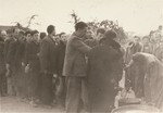 [Probably, Polish and Jewish civilians interned by the SD in a temporary holding center lining up for food.]

These prisoners may be what the Germans called "Wehrfaehige," or persons capable of carrying arms, who were often summarily interned during and immediately after the Polish campaign as a security measure.