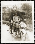 Anna Strzelczyk sits on a motorcycle with Michal Kempinski, who smuggled her out of the Bialystok ghetto.