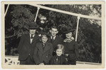 A Jewish family poses for a group portrait in a garden in Antwerp.