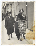 A Romanian Jewish family walks down a street in Cernauti.