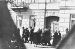 Jews are led through the streets of the town on their way to the railroad station during a deportation action from the Siedlce ghetto.