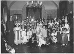Jewish children attend a Purim costume party in an opulent apartment in Rome owned by a Hungarian Jewish woman.