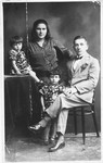 Studio portrait of the Rosenzweig family.

Pictured are Chava Lazerowitz Rosenzweig, Pini Rosenzweig and their daughters Shaindele and Bela.