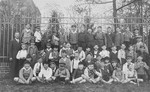 School children pose for a group portrait.  Peter Victor is among them.