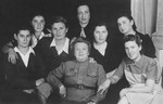 A group of female Jewish survivors pose with Dr. Nisenevitch, a Soviet army physician who befriended them and nursed them back to health.