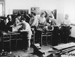 Jewish men participate in an ORT electrical motor winders training class in a machine workshop in the Feldafing displaced persons camp.