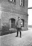 Police Seargent Joef Herkert stands outside a building probably in Wuerzburg.