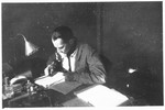 Otto Giniewski (later Etan Guinat), a Zionist activist and leader of the Armée Juive, writes at his desk at the University of Grenoble.