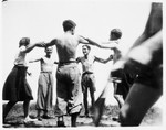 Members of Armée Juive dance a horah in their training camp in the Alps.