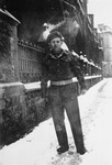 Portrait of one of the Jewish Brigade soldiers who accompanied members of the Kibbutz Buchenwald hachshara to Palestine, on [Oostenstraat] a street in Antwerp, Belgium.