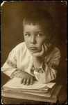 Studio portrait of a young Jewish boy in Eisiskes.