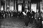 Constantin Freiherr von Neurath and Otto Meissner stand behind Adolf Hitler during his speech to the diplomatic corps at a New Year's reception.
