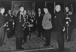 Adolf Hitler greets a Japanese naval delegation.