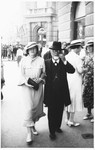Silva Basch walks down a street in Zagreb accompanied by her father, Rabbi Leopold Deutsch.