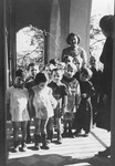Julie Hermanova, a Czech Jewish nursery teacher, poses with a group of young children in the Vence children's home.