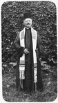 Portrait of Rabbi Leopold Deutsch wearing a prayer shawl and clerical robes.