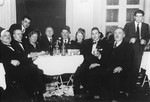 A group of Jewish friends in Zagreb raise their glasses at a social gathering to celebrate the holiday of Purim.