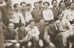 Group portrait of members of the Kibbutz Haghibor hachshara and sports club in the Bergen-Belsen DP camp.
