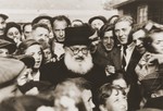 Rabbi Isaac Herzog, Ashkenazi chief rabbi of Palestine, addresses a crowd during an official visit to one of the displaced persons camps.
