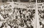 DPs in the Landsberg displaced persons camp attend a demonstration to protest against British immigration policy to Palestine.