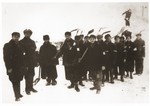 Jewish laborers wearing armbands are forced to shovel snow in Slawkow, Poland.