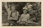 Close-up portrait of three Jewish children in Drohobycz.