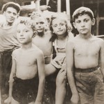 Group portrait of Jewish DP children on the deck of the Mala immigrant ship while en route to the new State of Israel.