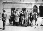 Rabbi Lifschitz, in the company of Jewish Brigade soldiers, carries a Torah scroll that has been rescued, to the Sephardic synagogue in the Venice ghetto.