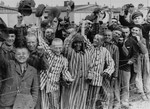 Young and old survivors in Dachau cheer approaching U.S.