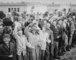 Young and old survivors in Dachau cheer arriving U.S.