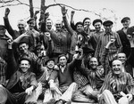 Polish prisoners in Dachau toast their liberation from the camp.