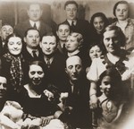 Group portrait of members of the extended Broda family at a gathering to celebrate the birth of the son of Aron and Sheindel Broda in Katowice.