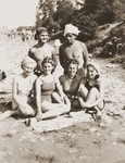 Three Jewish girls in hiding relax on a beach with a Romanian girlfriend.