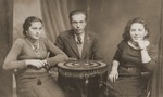 Studio portrait of three Jewish friends in Kanczuga, Poland.