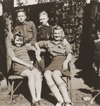 Four orphans pose outside at the Jewish children's home in Gleiwitz, Poland.