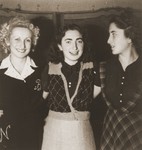 Three young women pose in the Cernauti ghetto.

Pictured from left to right are Beatrice Neuman, Erika Neuman and their friend Cila Loewenthal.