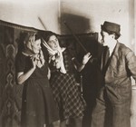 Three young Jews act in a play in the Cernauti ghetto.