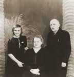 Studio portrait of the Turkin family with their adopted Jewish daughter whom they hid during the war.