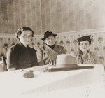 Three Austrian Jewish refugee women seated at a table in La Paz, Bolivia.