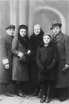 Members of the Kleinhandler family in the Chmielnik ghetto wearing armbands.