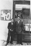 Zygmunt Godzinski (right) poses with a friend outside a business in Kielce.